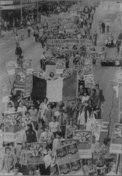 Followers of Guru Maharaj Ji march in downtown Houston