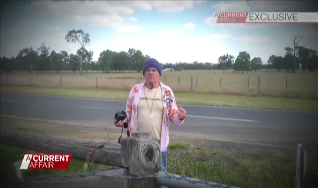 Footage of a man with a camera on a rural property